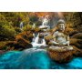 Fototapetti - Orient - landscape with Buddha sculpture on a background of a waterfall and exotic forest